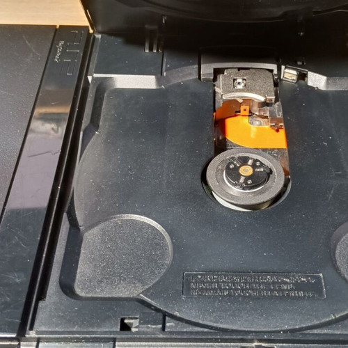 PlayStation 2 Slim used with adjusted laser and functional controller