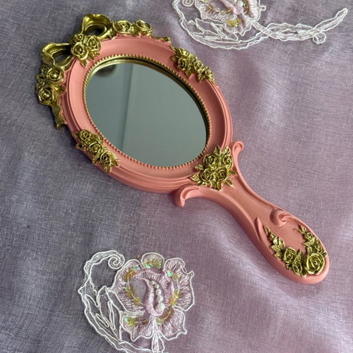 Vintage pink hand mirror like new