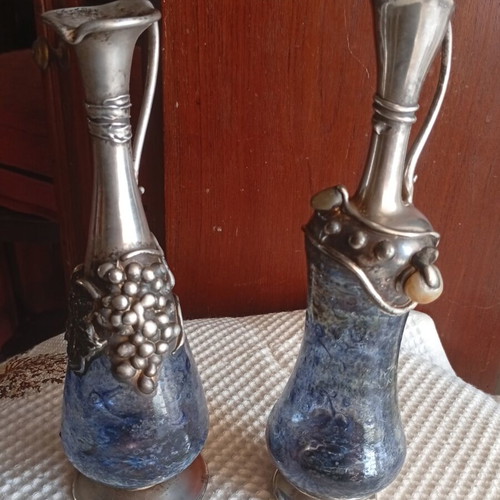 Vintage decorative silver pitchers with blue blown art glass