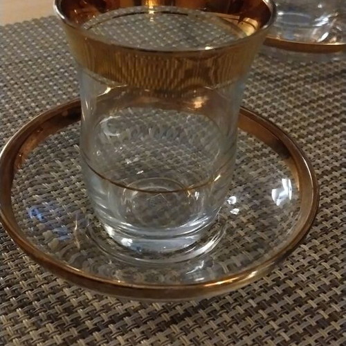 Glasses with Saucers like new with Gold Decoration