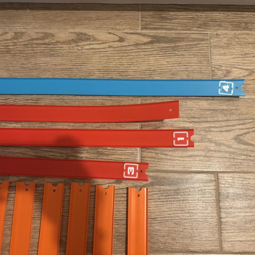 Hot Wheels track set with orange straight and colored action pieces
