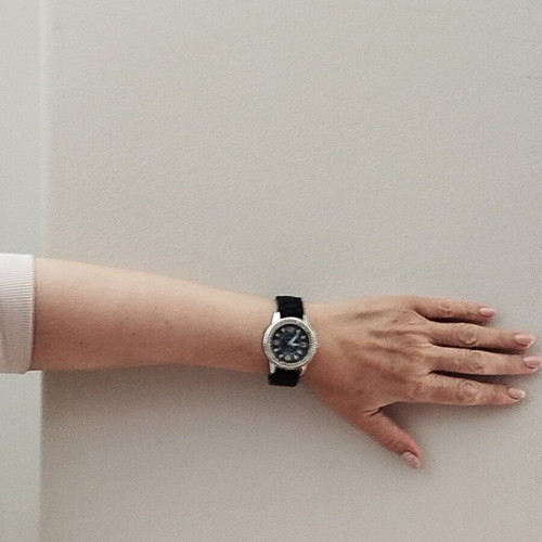 Newman watch used with blue dial and white crystals