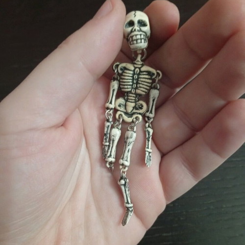 Skeleton keychain used, vintage style, white, with movable parts