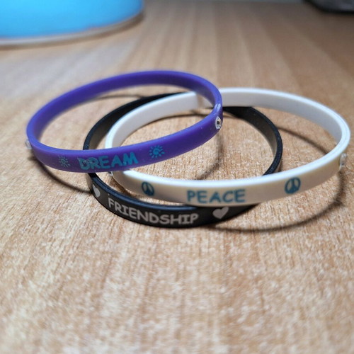 Rubber bracelets like new, set of 3, white and purple