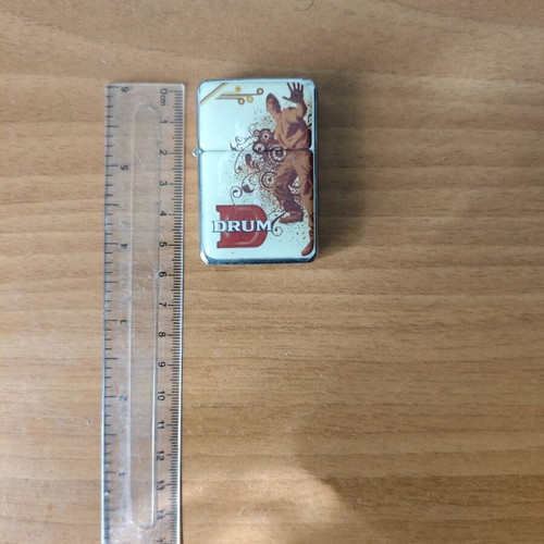 Drum promotional lighter used, functional, collectible