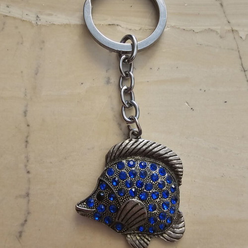 Keychain used, fish design with blue stones