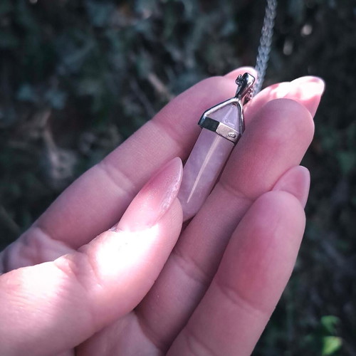Rose quartz crystal pendant used with silver chain