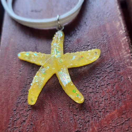 Handmade starfish pendant necklace with white cord, yellow iridescent