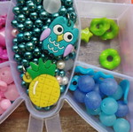 Colored beads used with thread, incomplete set