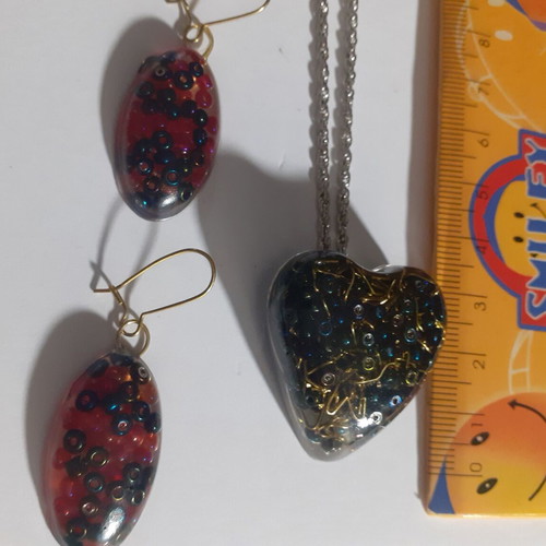 Set of 7 handmade pendant and earring jewelry sets with resin and dried herbs