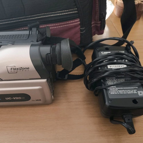 Canon camera like new with tripod, charger and carrying bag
