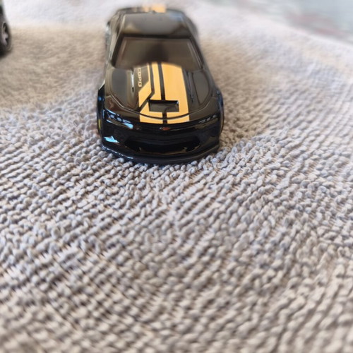 Land Rover Defender and Cord Camaro toy cars, set of 2