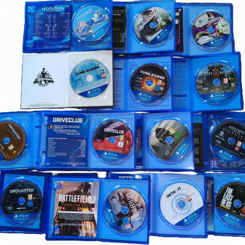 Sony PlayStation 4 Slim 1TB console used with 2 DualShock controllers and 14 games