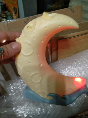 Moon toy that changes colors and creates stars