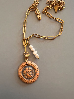 Necklace with ceramic pendant like new, beige