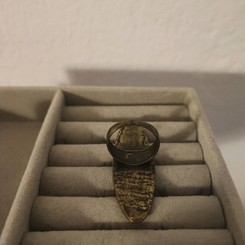 Ring with embossed designs adjustable size, like new