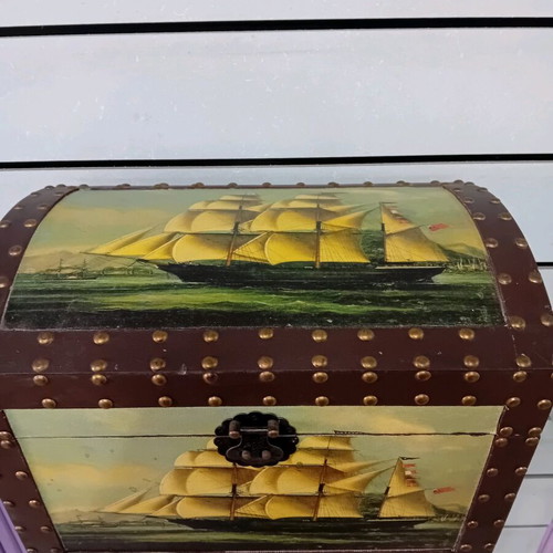 Small trunk used with ship decor and leather handles