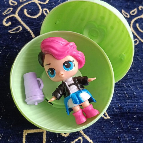 Doll figure from ball toy, black-pink hair, blue eyes