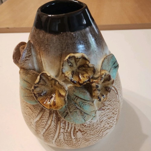 Clay vase like new with embossed flowers 0.14 height