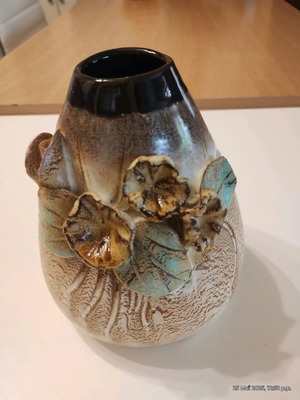 Clay vase like new with embossed flowers 0.14 height