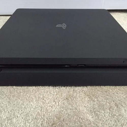 Sony PS4 500GB console with 2 controllers and 4 games