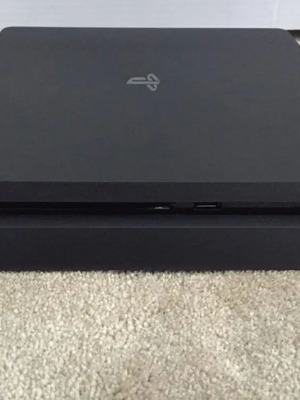 Sony PS4 500GB console with 2 controllers and 4 games