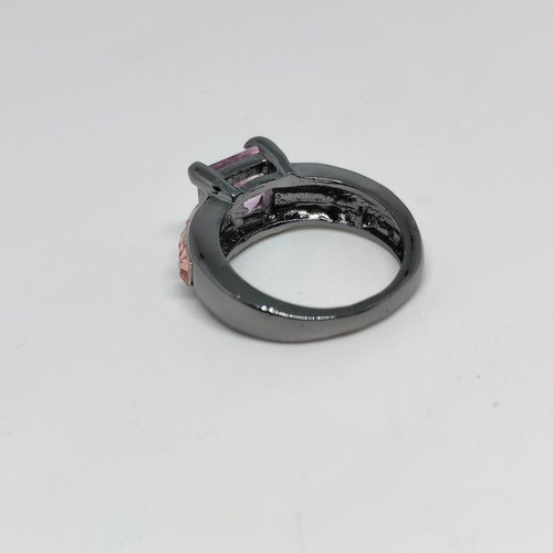 Ring with purple central crystal and pink details in black metal like new