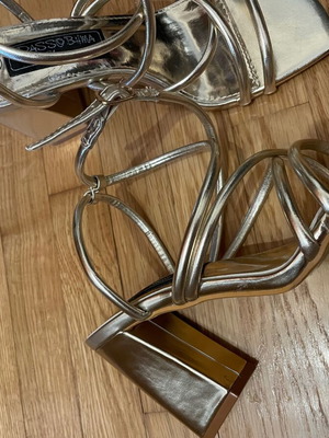 Gold sandals with straps and thick heel in like new condition