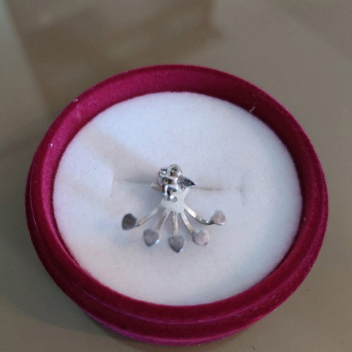 Silver earring that hugs the ear from below