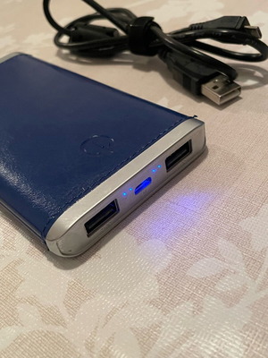 Portable battery used with charging cable