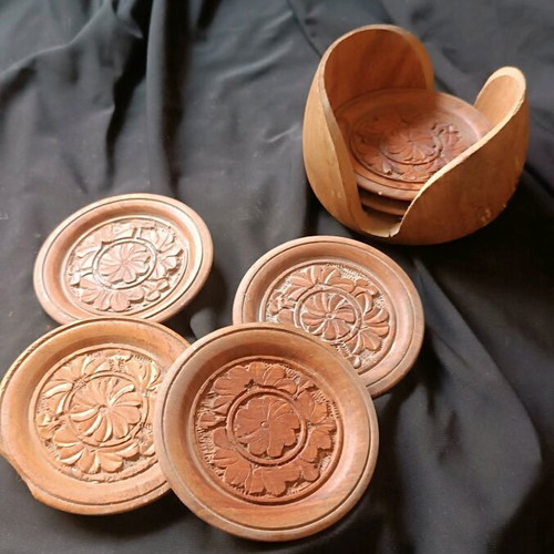 Wooden vintage hand-carved coasters used