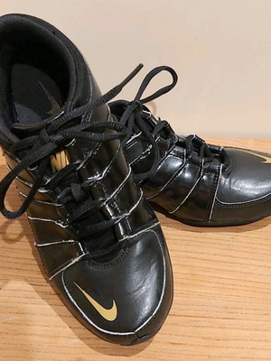 Nike athletic shoes used size 38 black with gold logo