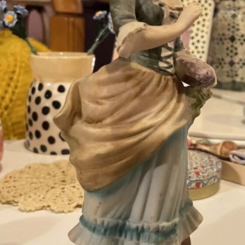 Porcelain decorative figurine of a girl with matte finish like new