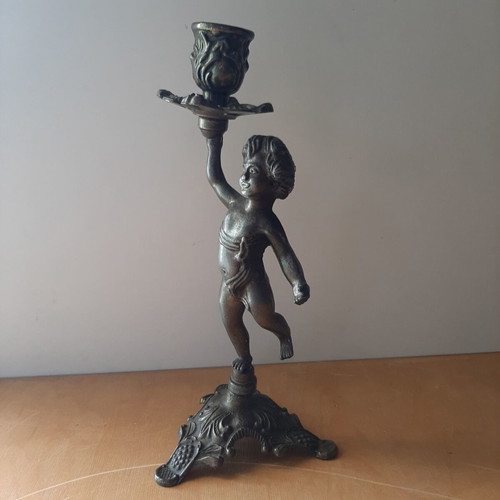 Vintage metal candlestick with boy figure like new
