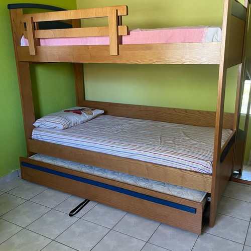 Wooden bunk bed with third sliding bed and mattresses like new