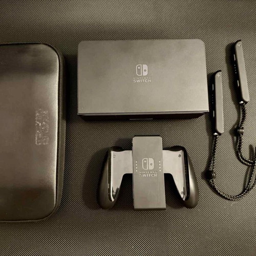 Nintendo Switch OLED used with carrying case and 256GB memory card