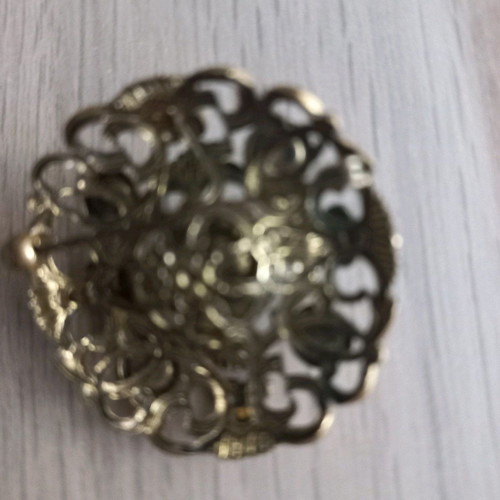 Traditional old brooch with stone