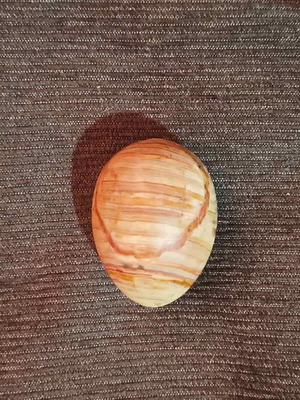 Decorative egg made of banded aragonite like new