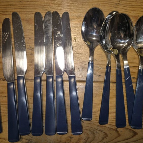 Blue cutlery set used, missing small spoon