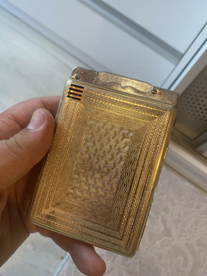 Tobacco case with petrol lighter used