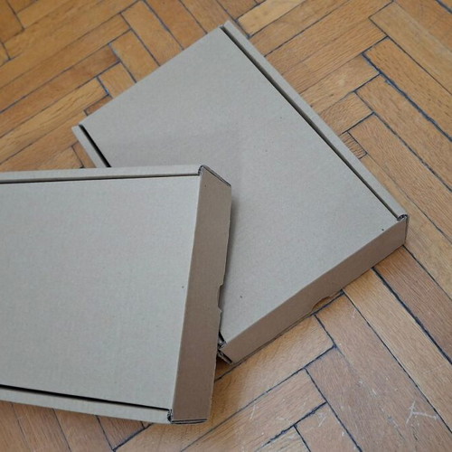 Four courier shipping boxes, kraft cardboard