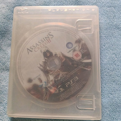 PlayStation 3 (PS3) like new with cable, controller and Assassin's Creed II
