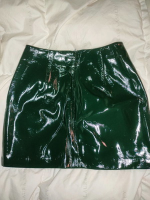 Patent leather skirt dark green with ruffle details used, size small