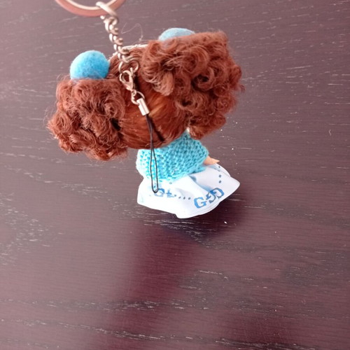 Keychain girl with blue clothes like new