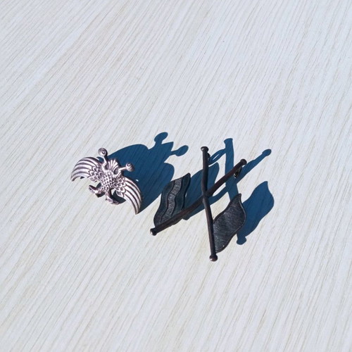 Silver pins used with eagle and crossed flags
