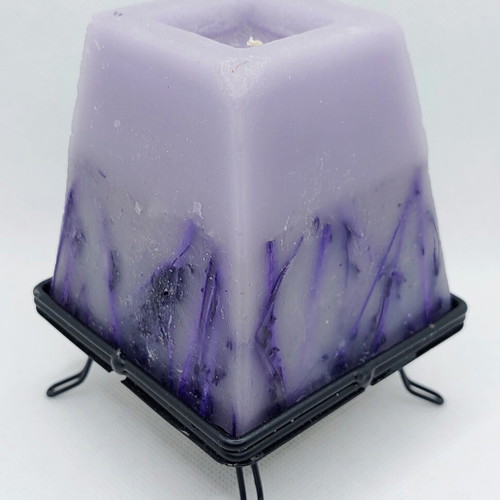 Decorative purple lavender candle with metal base