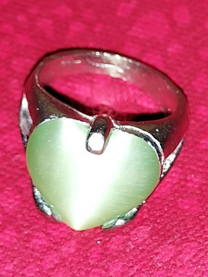 Silver ring used with green semi-precious stone