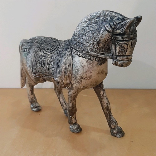 Vintage metal horse used with carved details