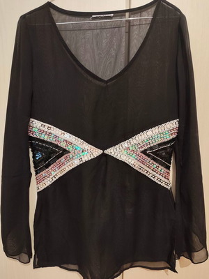 Black sheer blouse used with colorful embroidery and asymmetric sleeves