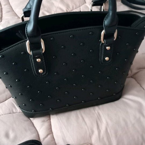 Women's bag used, black handheld with strap and gold details